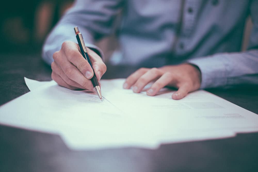 Person signing documents 