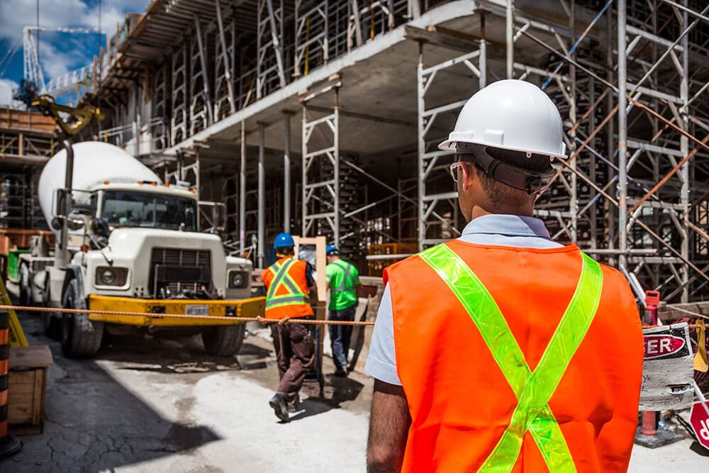 Construction worker facing work zone