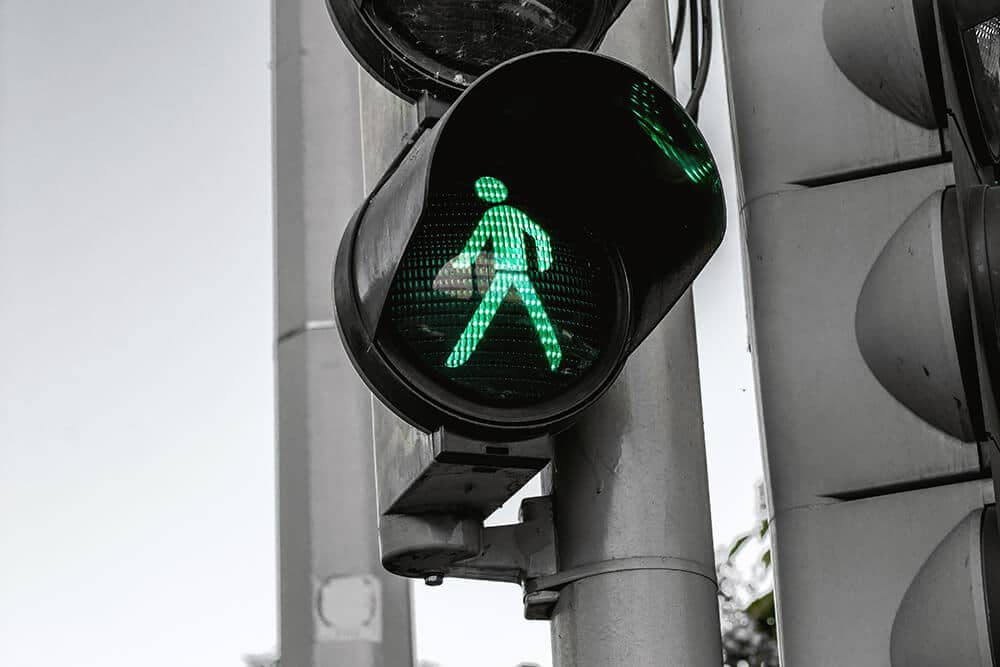 Green walking sign in traffic light