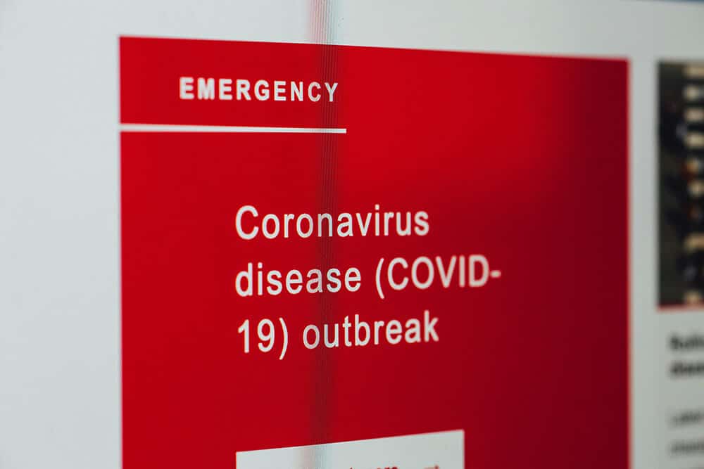 hospital sign that reads coronavirus disease (COVID-19) outbreak