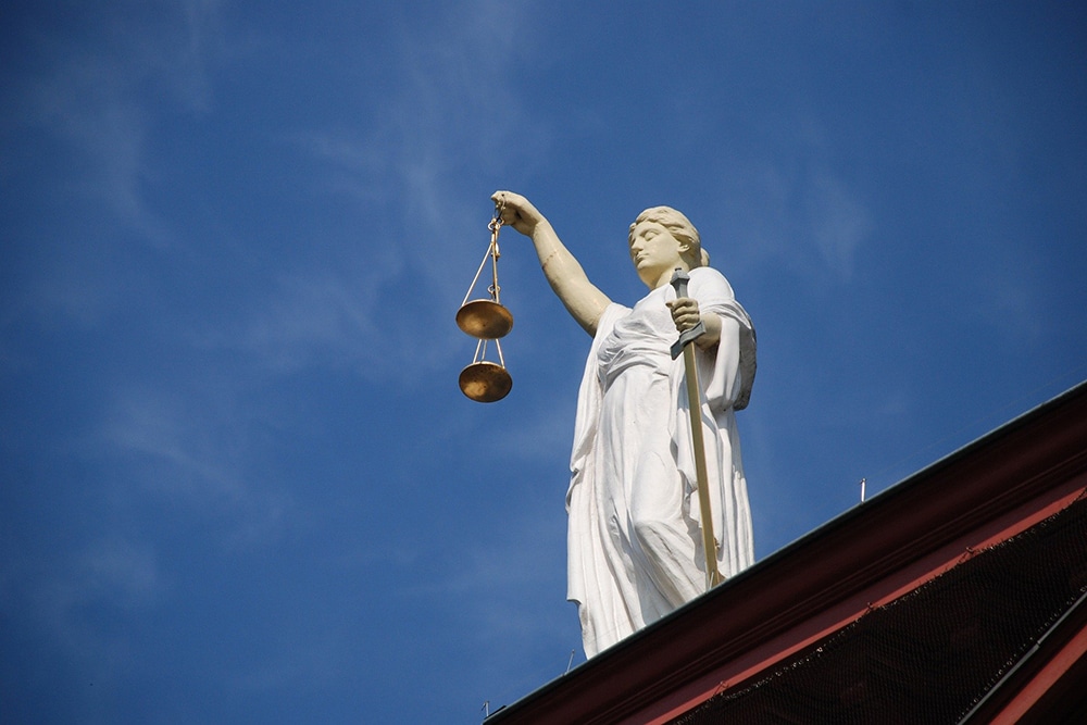 statute of person holding scales 