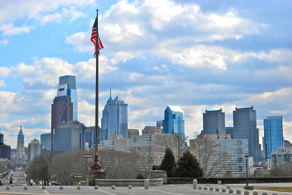 Flag pole with Philadelphia in the background